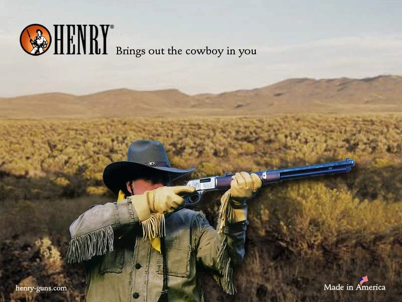 Man with Henry lever-action rifle in western desert landscape