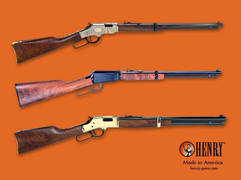 Collection of Henry lever-action rifles against an orange background