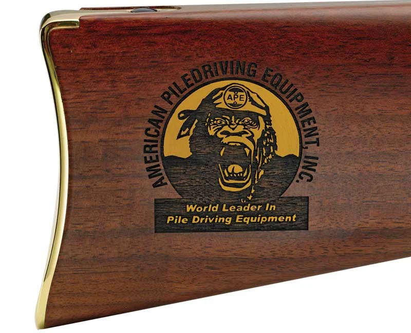 Close-up view of the Henry Repeating Arms logo on a wooden rifle stock