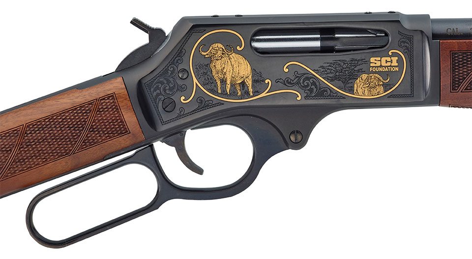 Close-up of lever-action rifle with Safari Club International engraved design