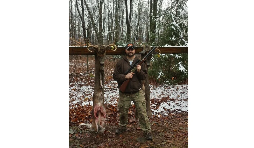 Henry Repeating Arms firearm being used by a hunter to hunt deer in a snowy forest