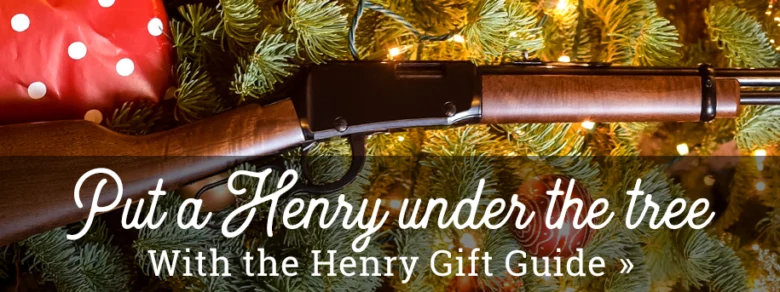 Henry Repeating Arms gift guide banner featuring a lever-action rifle under a Christmas tree