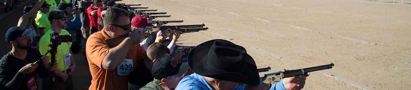 Shooters training and target practice at an outdoor rifle range with various firearm models