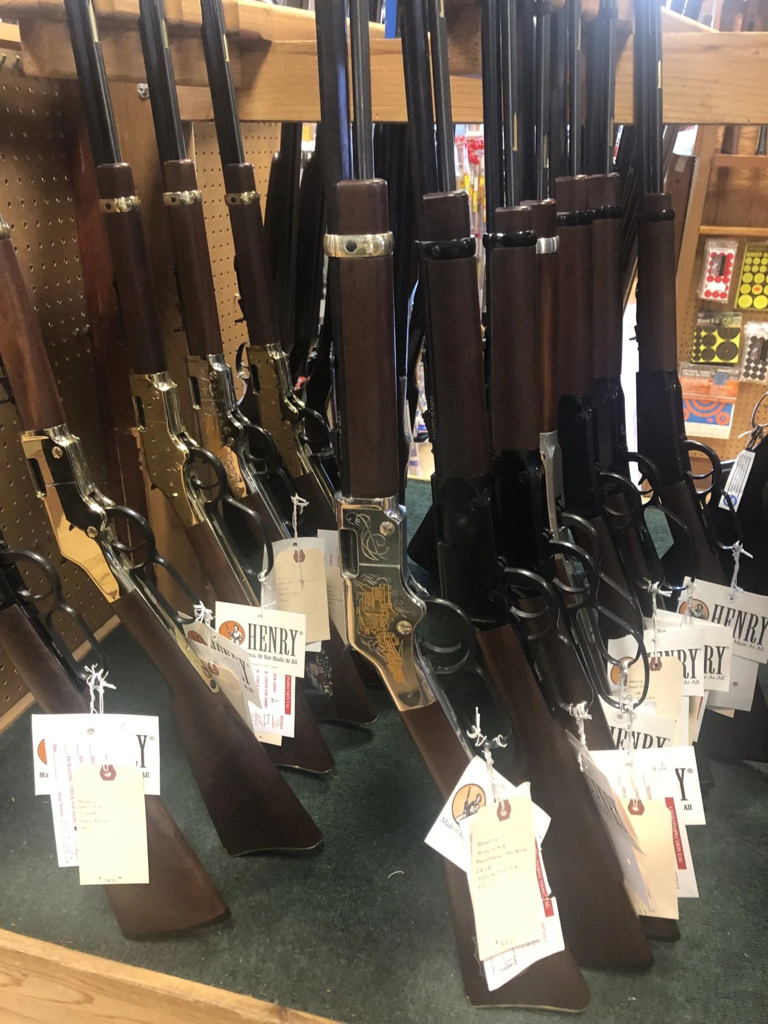 Display of various Henry lever-action rifles and shotguns at First Stop Gun Shop in Rapid City, South Dakota