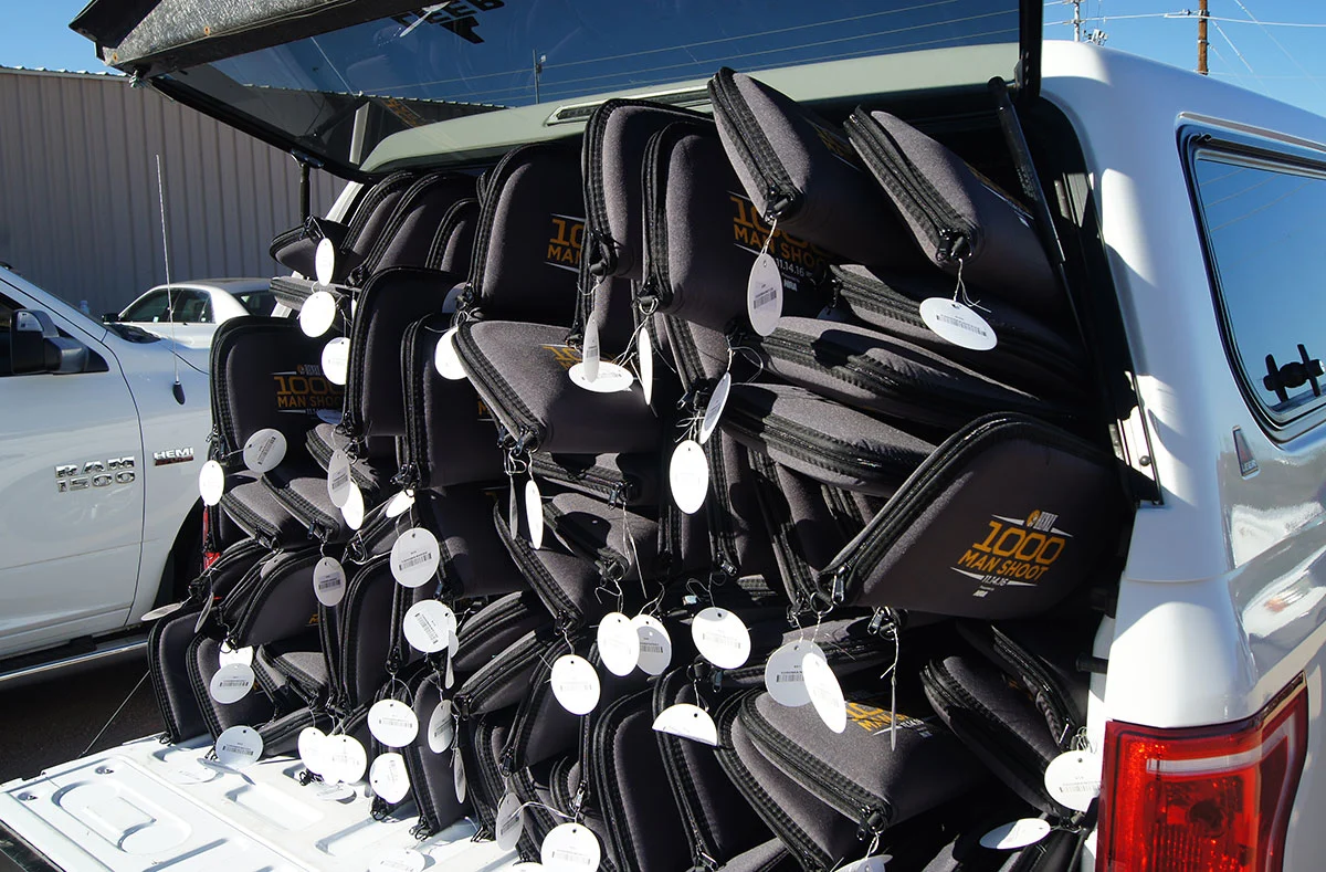 Celebration of the 1,000 Man Shoot at Henry Repeating Arms, showing a large display of rifles