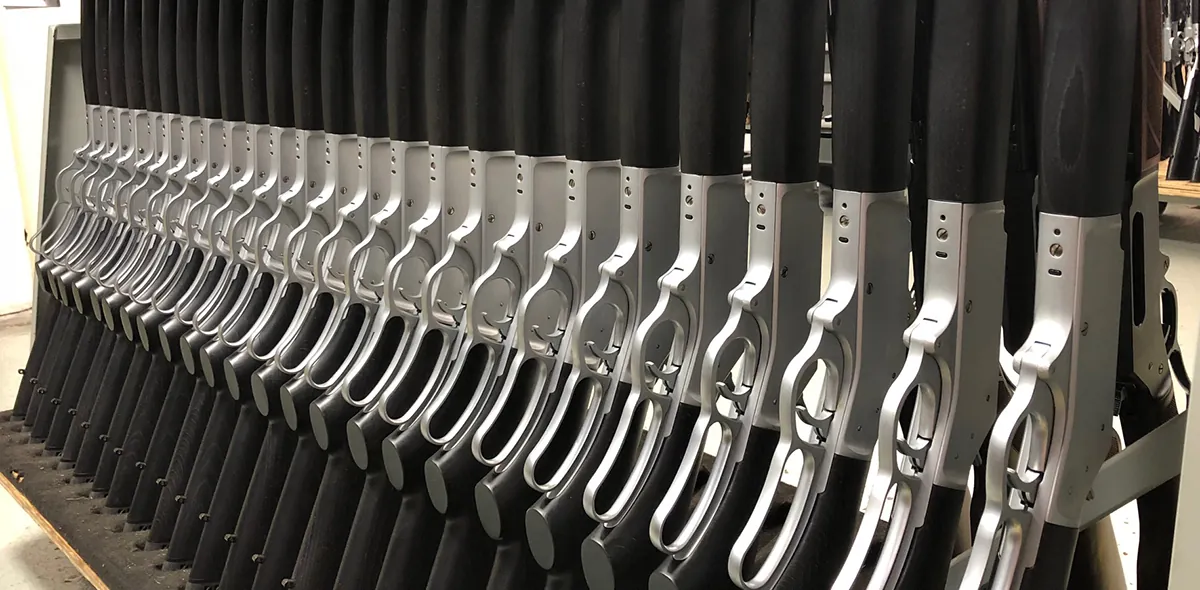 Henry Rifles- Henry Gives Factory Tour- row of rifles