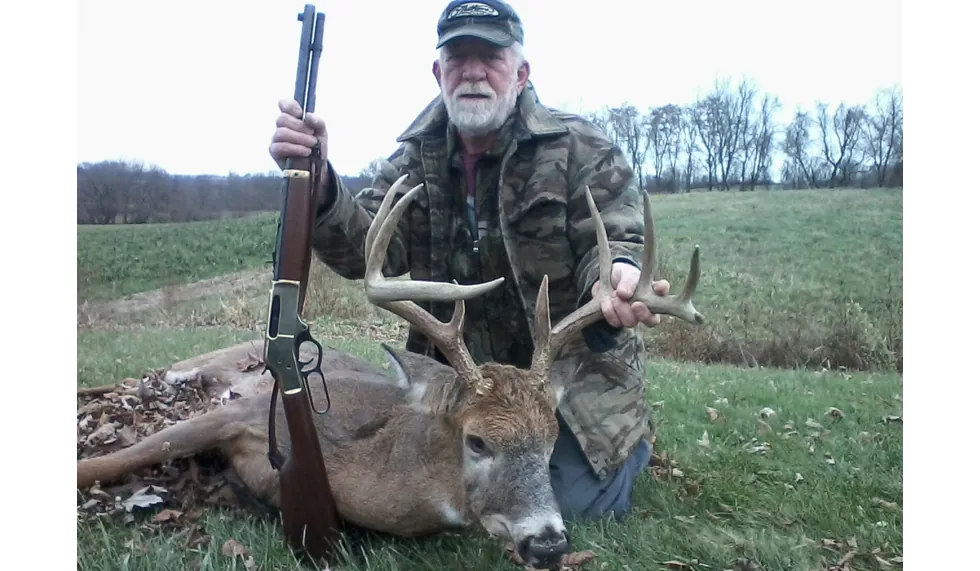 Don Bare- Hunter with deer