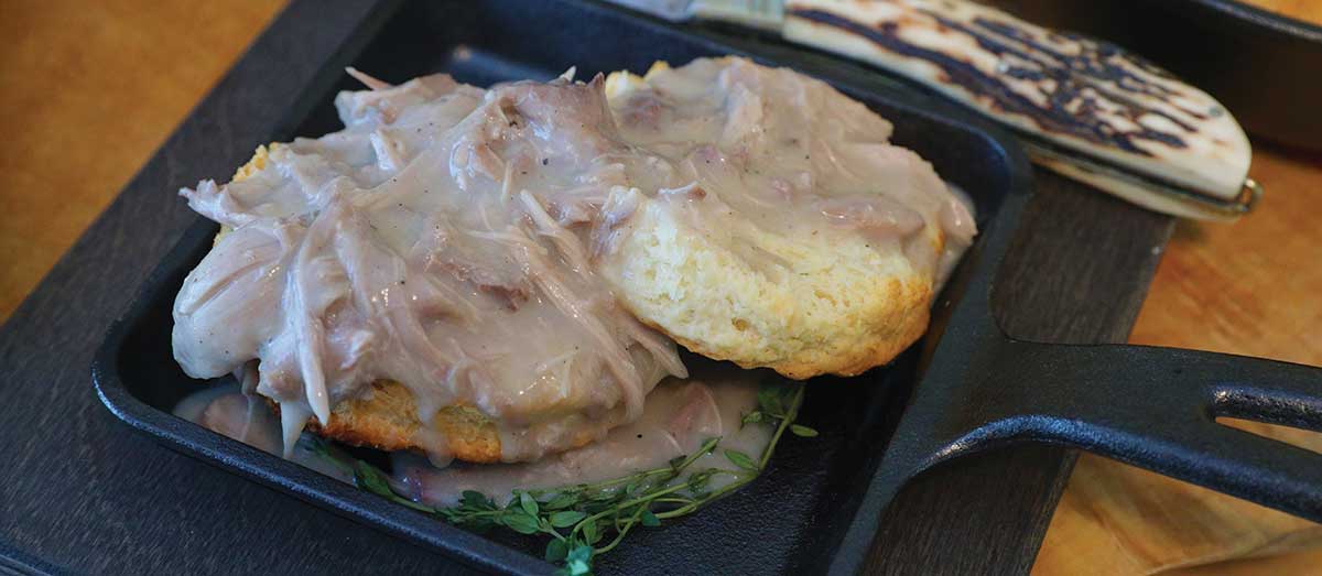 Delicious squirrel gravy served over a savory lever-action rifle