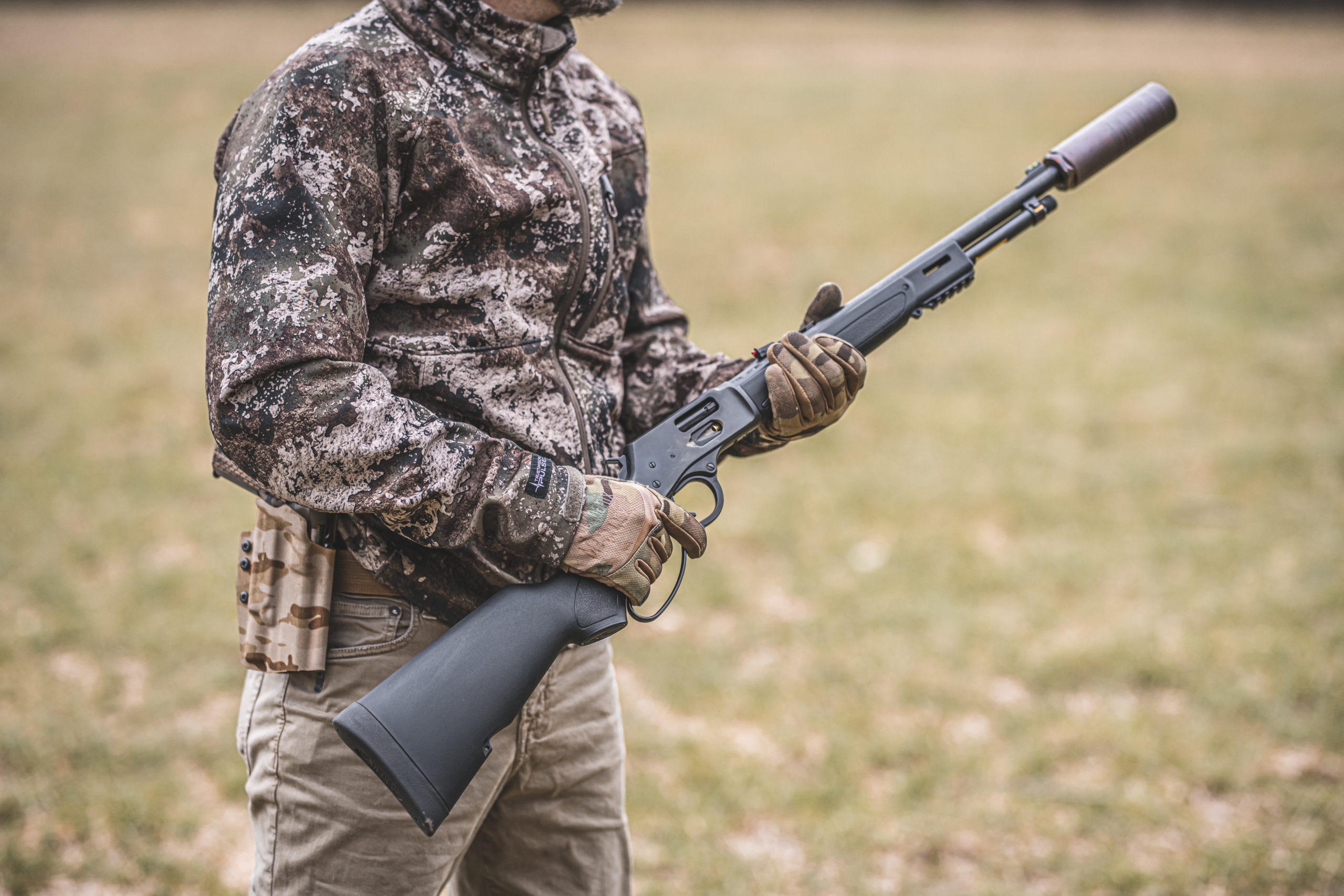 Custom Henry Repeating Arms lever-action rifle with department badge engraved on genuine American walnut stock, designed for law enforcement use