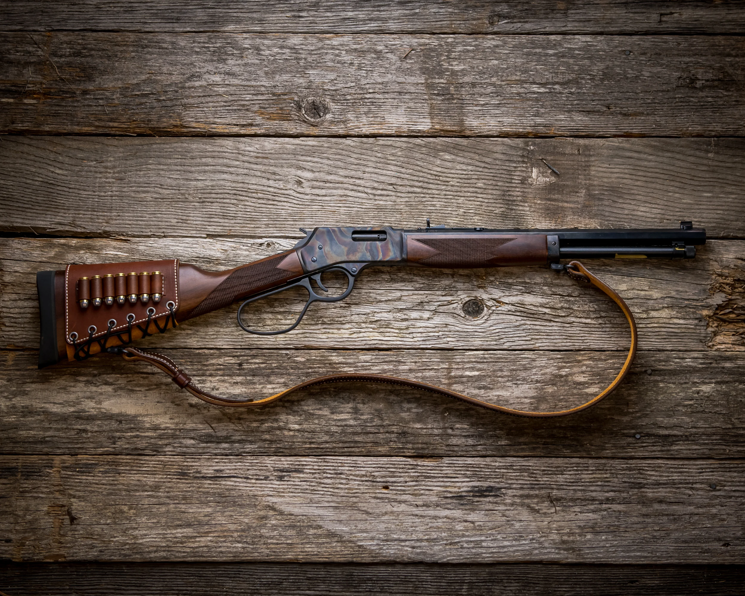 Custom Henry Repeating Arms lever-action rifle with department badge engraved on genuine American walnut stock, designed for law enforcement use