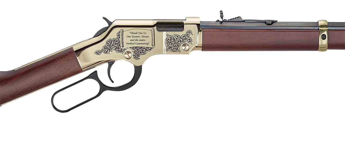 Close-up view of a Henry lever-action rifle with intricate engraved details on the receiver