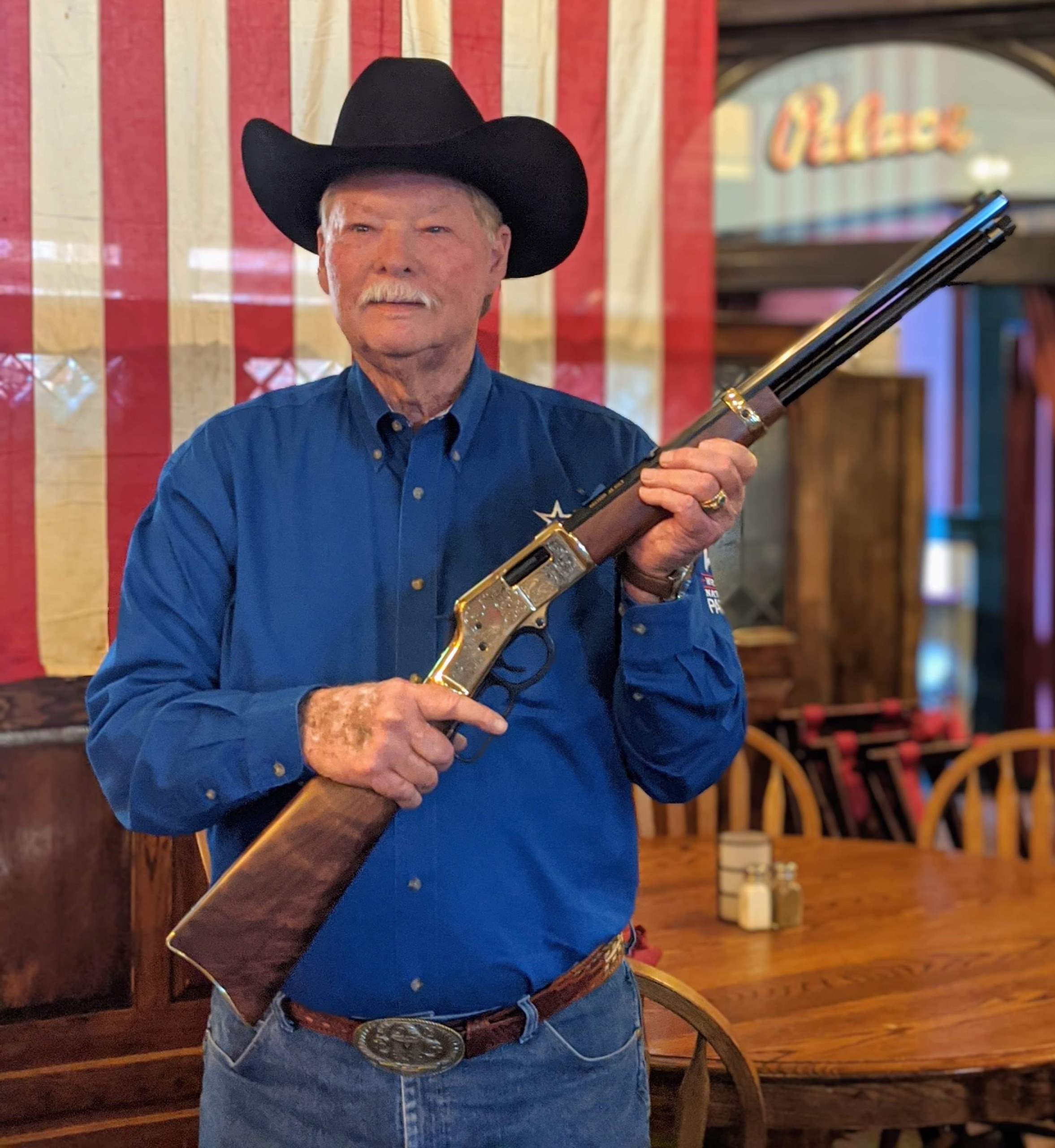 Frank Shankwitz holding Henry Big Boy Deluxe Engraved rifle