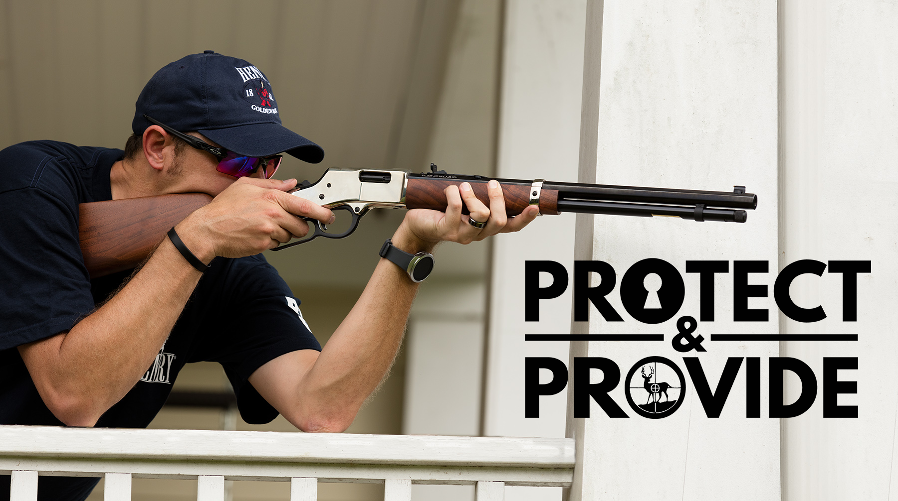 22plinkster aiming Henry Big Boy rifle using a railing as support with Protect & Provide logo
