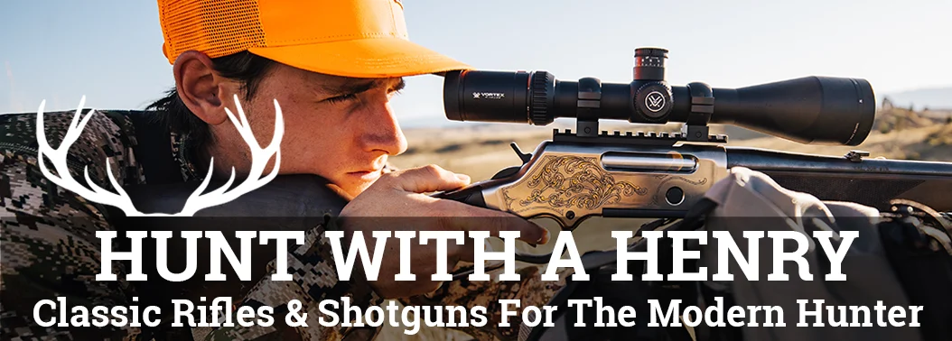 Man aiming rifle with scope and Henry Repeating Arms logo, highlighting lever-action firearms and hunting equipment