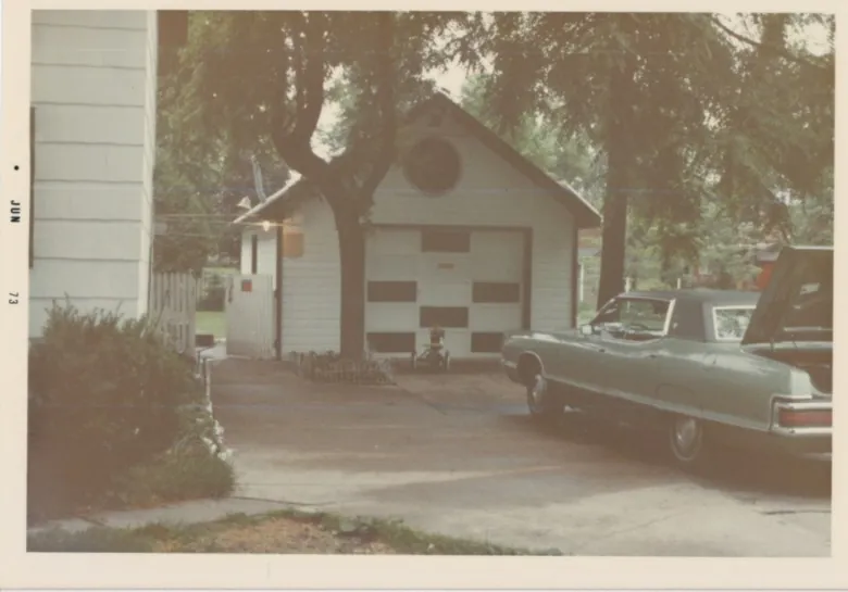 vintage photograph showing a small one-car garage