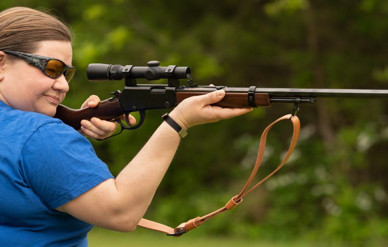 Woman shooting a rifle left-handed
