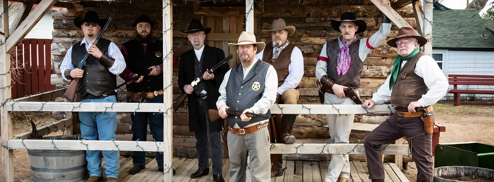 Group of cowboys in western-style clothing and gear celebrating National Day of the Cowboy
