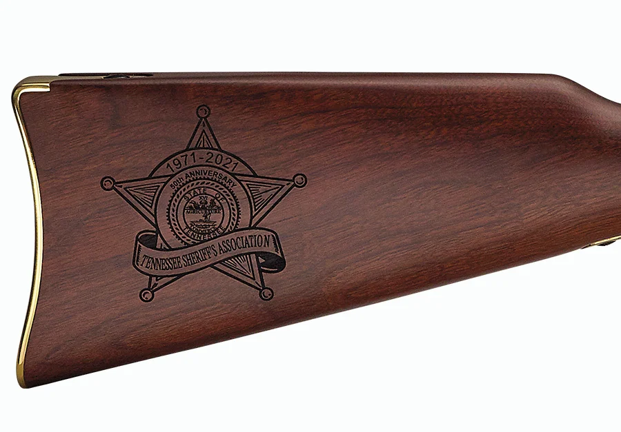 Custom Henry Repeating Arms rifle with engraved walnut buttstock