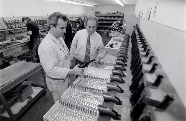 Anthony Imperato (left) and his father Louis Imperato (right) inspecting trigger guards at the Colt Black Powder Arms Co. factory in Brooklyn, NY in May 1995.