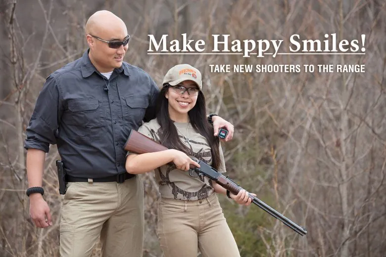 Woman smiling holding a rifle next to a man with a caption that reads "Make Happy Smiles! Take New Shooters To The Range."