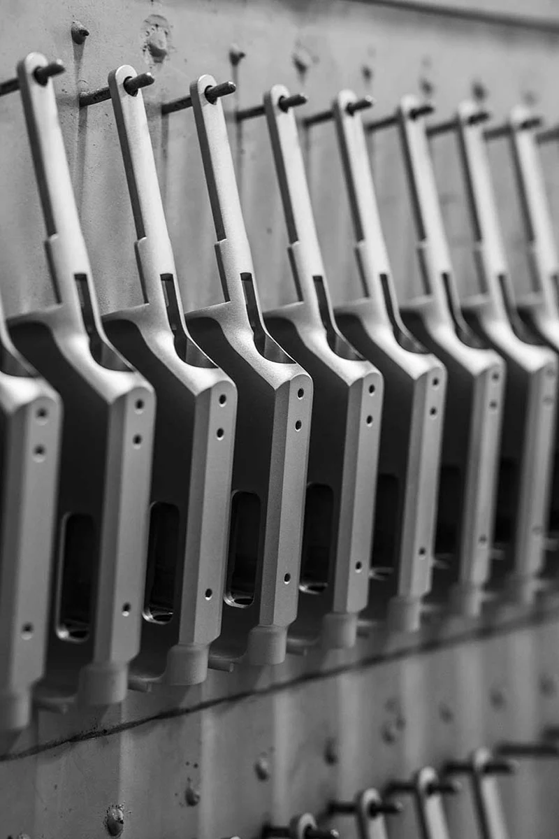 Row of Henry lever-action rifles in a firearms factory