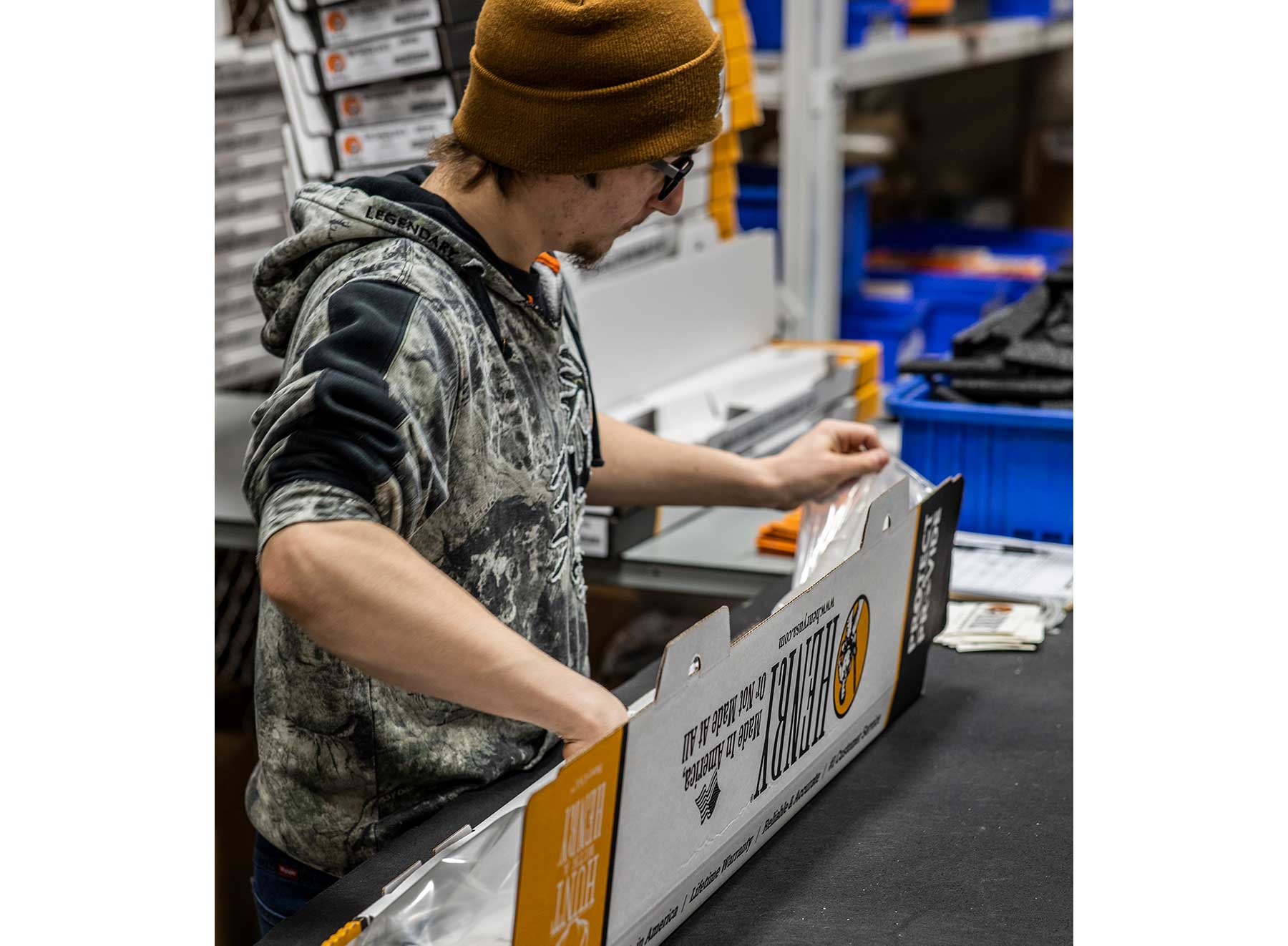 Henry rifle gunsmith packaging and display in factory warehouse