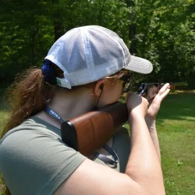 Author shooting a rifle offhand.