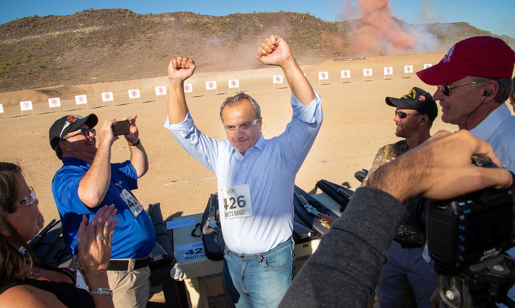 Man raising fists in celebration of Second Amendment rights