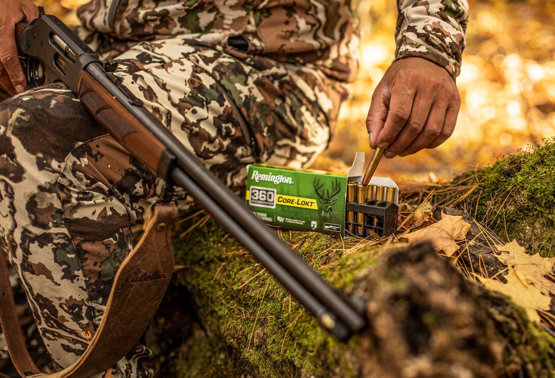 Henry Repeating Arms 360 Buckhammer lever-action rifle with ammunition in outdoor setting