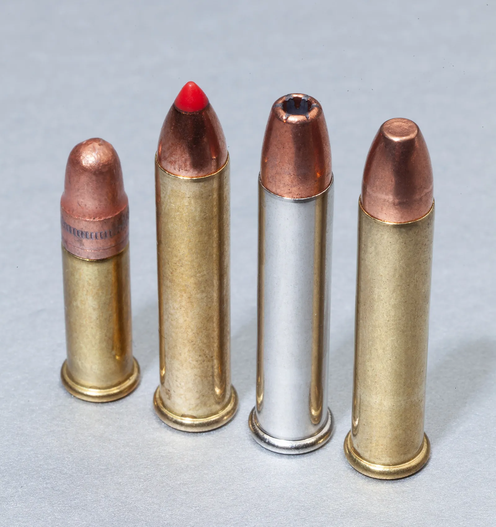 Image showing a size comparison of .22 LR next to three different .22 Magnum cartridges.