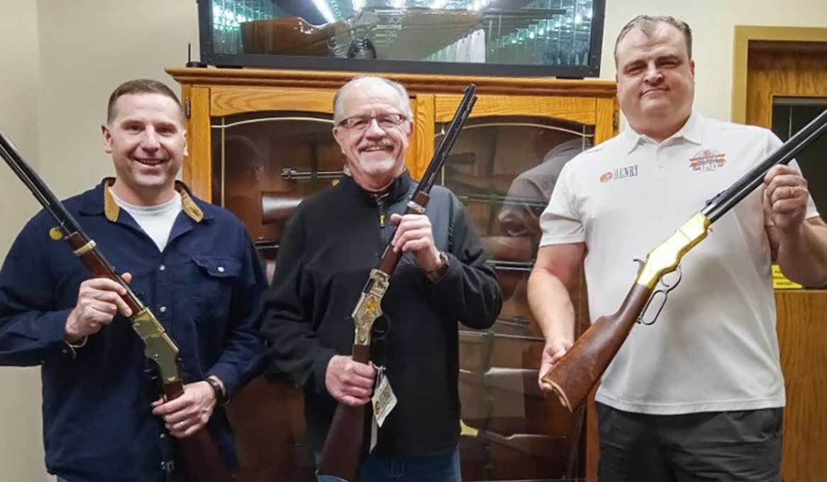 Three law enforcement officers proudly displaying Henry American Sheriff Tribute Edition rifles