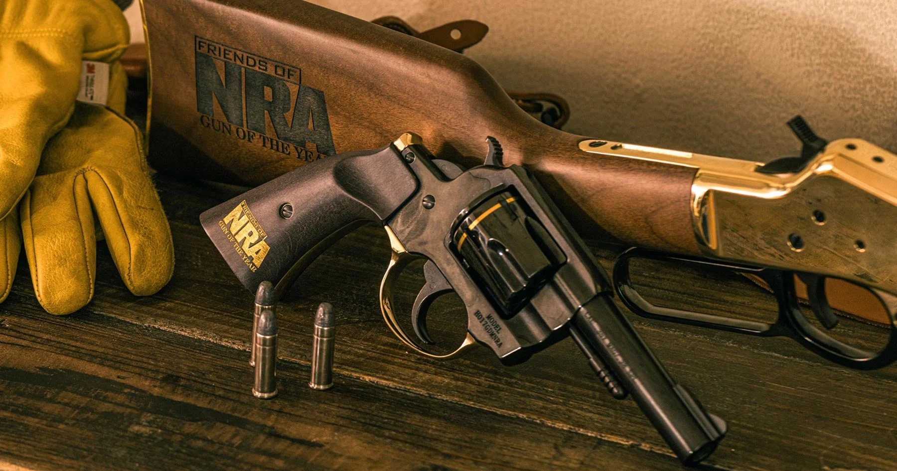 Three men in business suits standing with an award plaque displaying the Henry Repeating Arms logo and branding