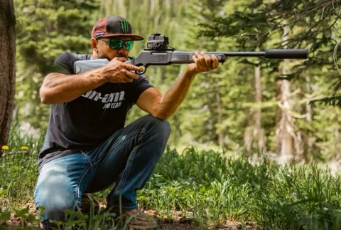 Cowboy figure wearing black hat and fur-lined jacket, looking to the side