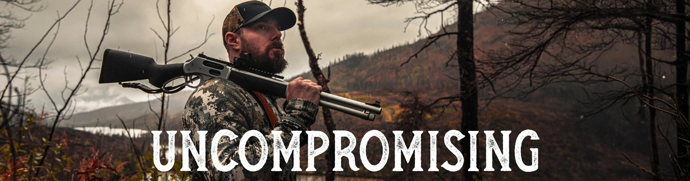 Rugged Henry All-Weather lever-action rifle in outdoor environment, delivering uncompromising performance