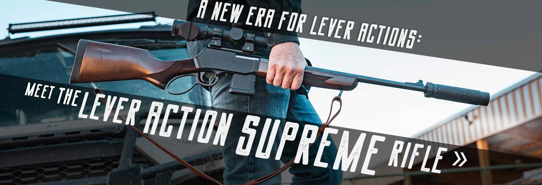 Lever-action Henry Repeating Arms Supreme rifle on display with tactical accessories