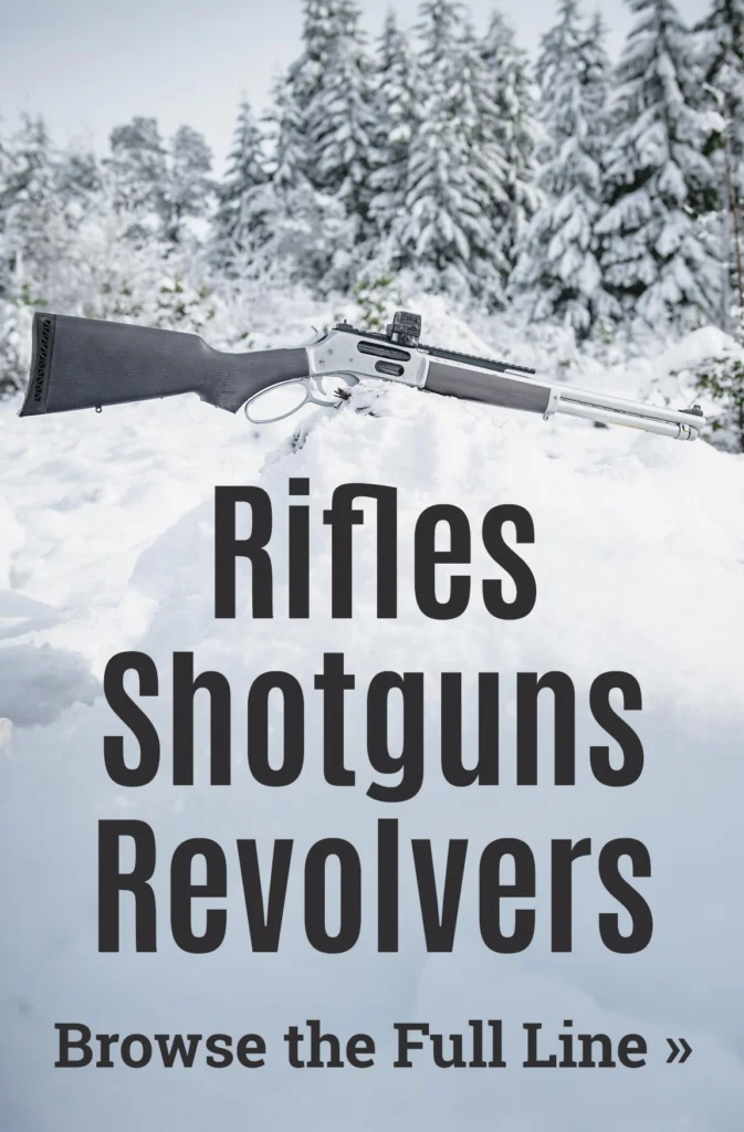 Snow-covered forest with various firearms - rifles, shotguns, and revolvers on display