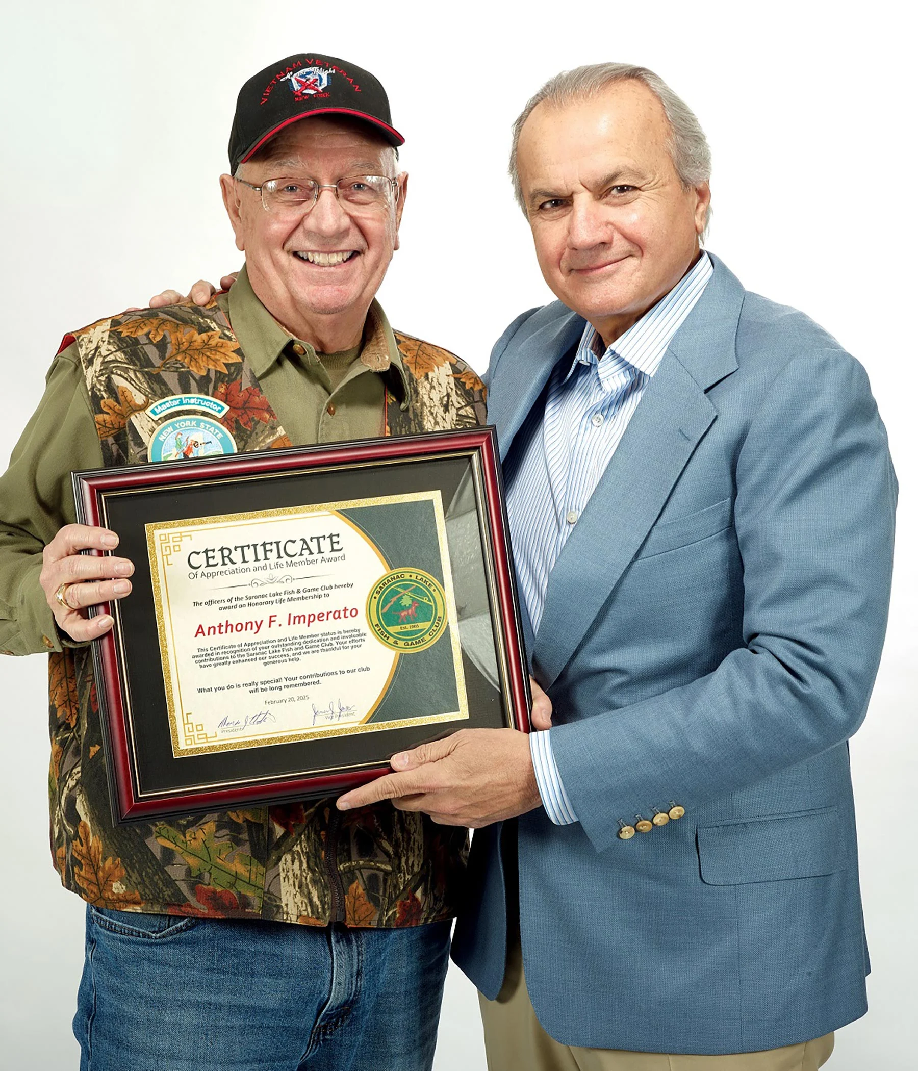 Three men in business suits standing with an award plaque displaying the Henry Repeating Arms logo and branding