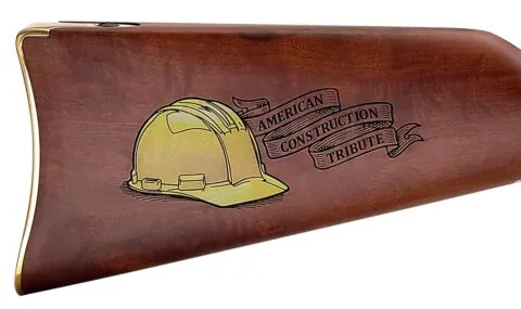 Henry Repeating Arms custom lever-action rifle with wood stock and silver-colored metal parts