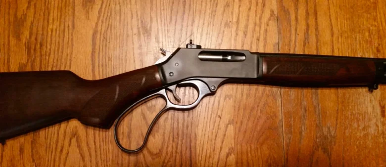 Henry Repeating Arms lever-action rifle with wooden stock and metal barrel