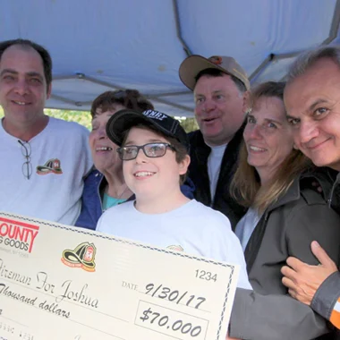 Family group presenting a Henry rifle to a young person as an award or recognition