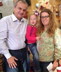 Family supporting young girl with illness in photo