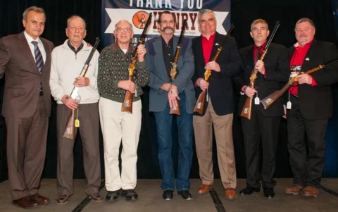 Group photo of veterans and first responders receiving awards from Henry Repeating Arms