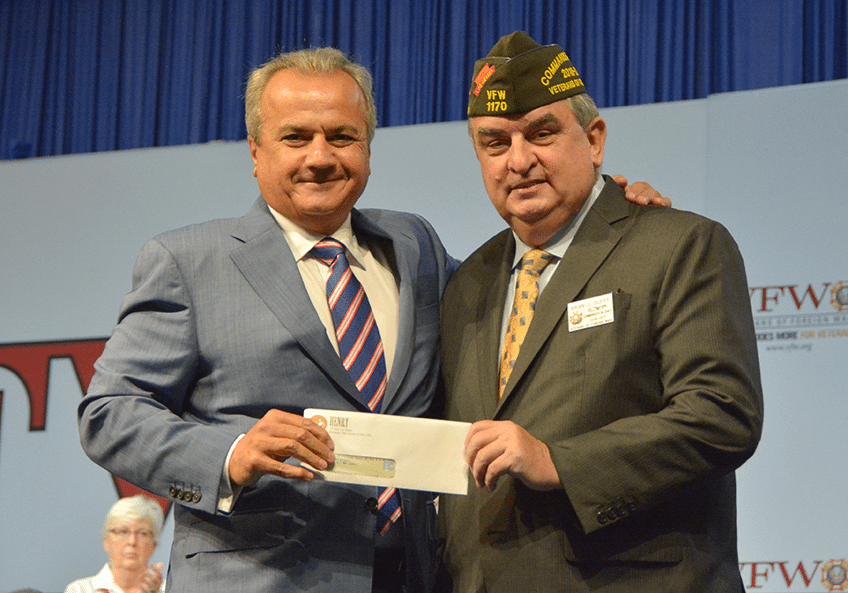 Henry Repeating Arms president presenting military service tribute rifle to VFW service officer