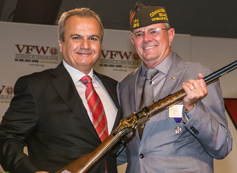 Henry Repeating Arms president presenting military service tribute rifle to VFW commander-in-chief