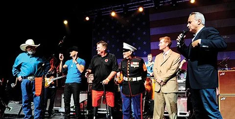 Henry Rifles presented to veterans onstage with Charlie Daniels at Volunteer Jam