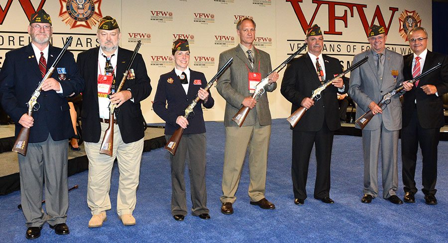 VFW group posing with Henry Repeating Arms military service tribute rifle
