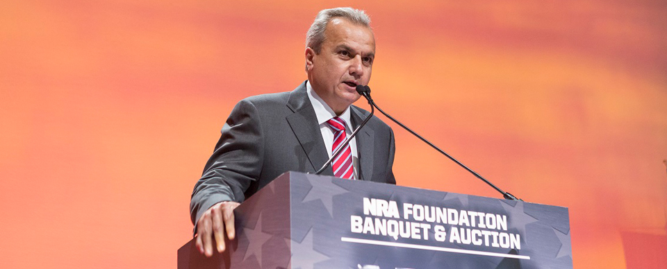 Man in suit speaking at the NRA Leadership Forum event
