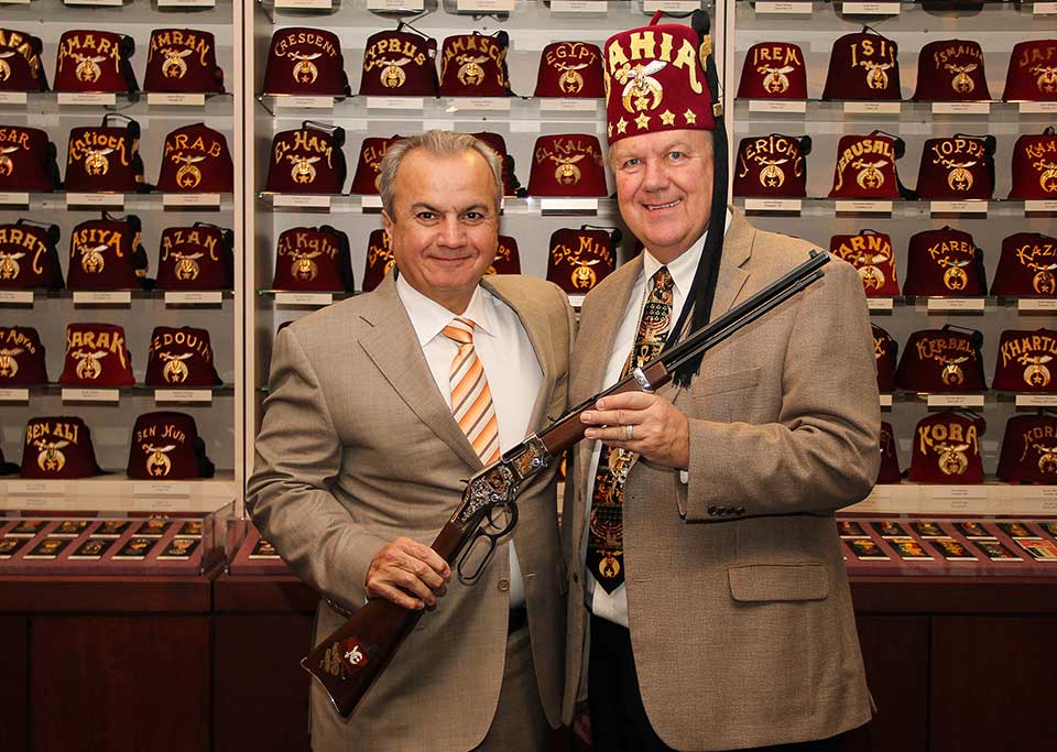 Henry Repeating Arms representatives posing with Shriners Tribute Edition rifle